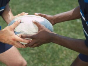 Two men playing touch Rugby